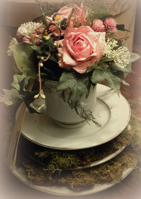 mossy teacup of flowers