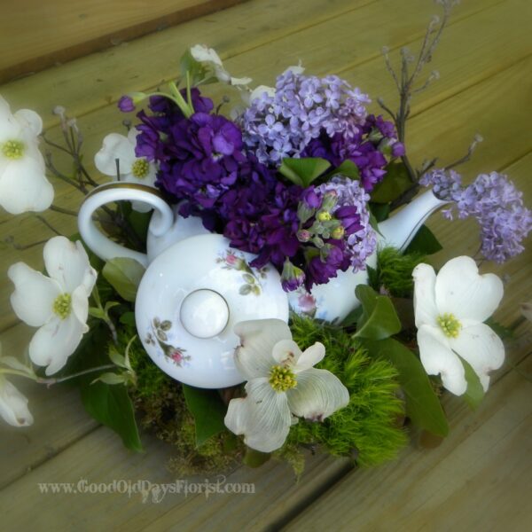 flower arrangement with a teapot